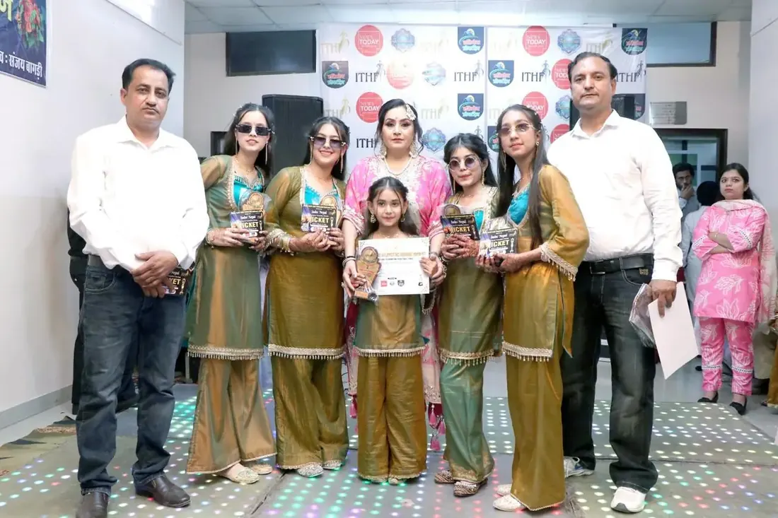 Prizewinners holding certificates alongside organisers, in front of an ITHF and News Today backdrop
